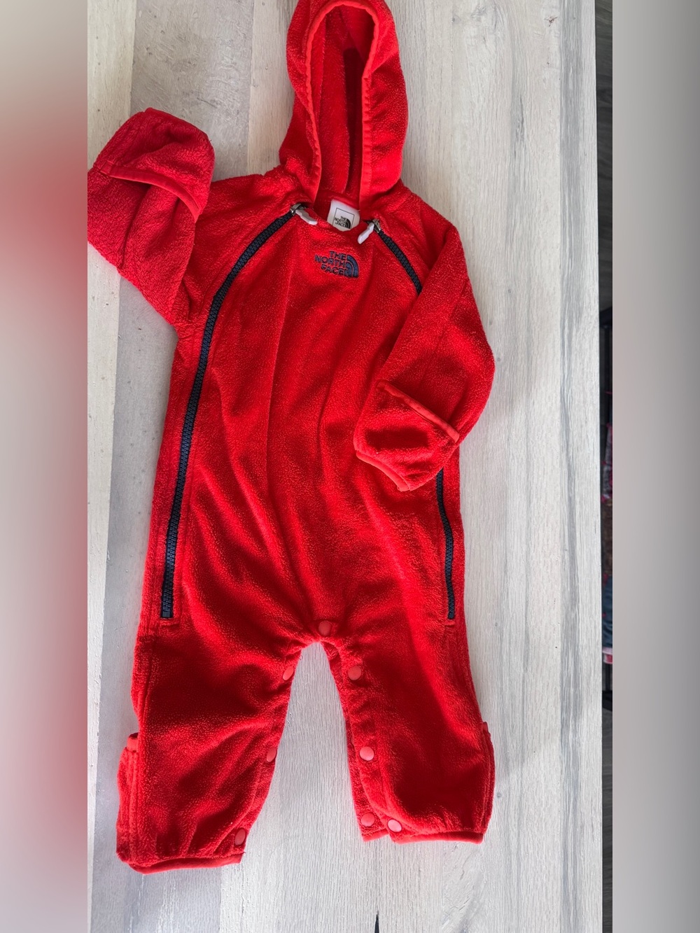 red The North Face fleece infant bunting suit with a double full-zip and hood